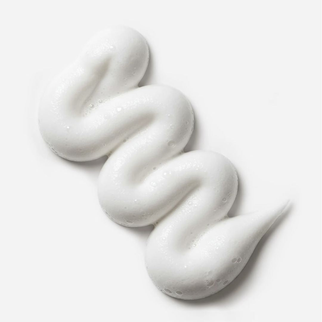 White cream or soap swirled on a white background
