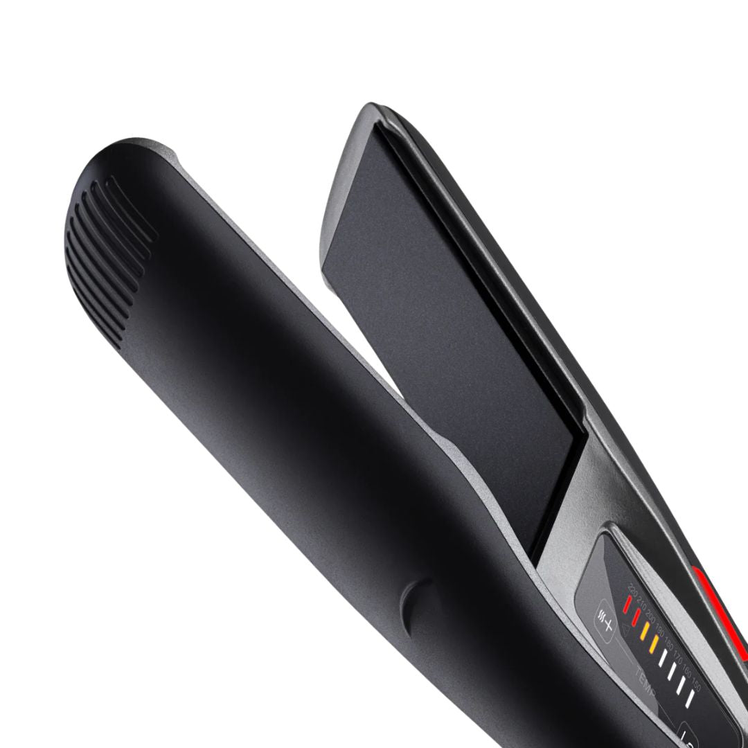 Black hair straightener on a white background